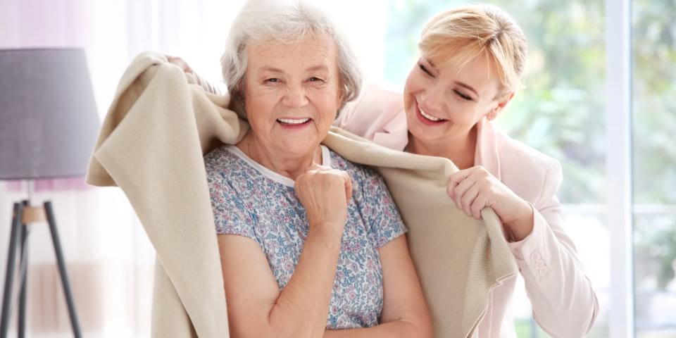 senior woman smiling with beautiful woman